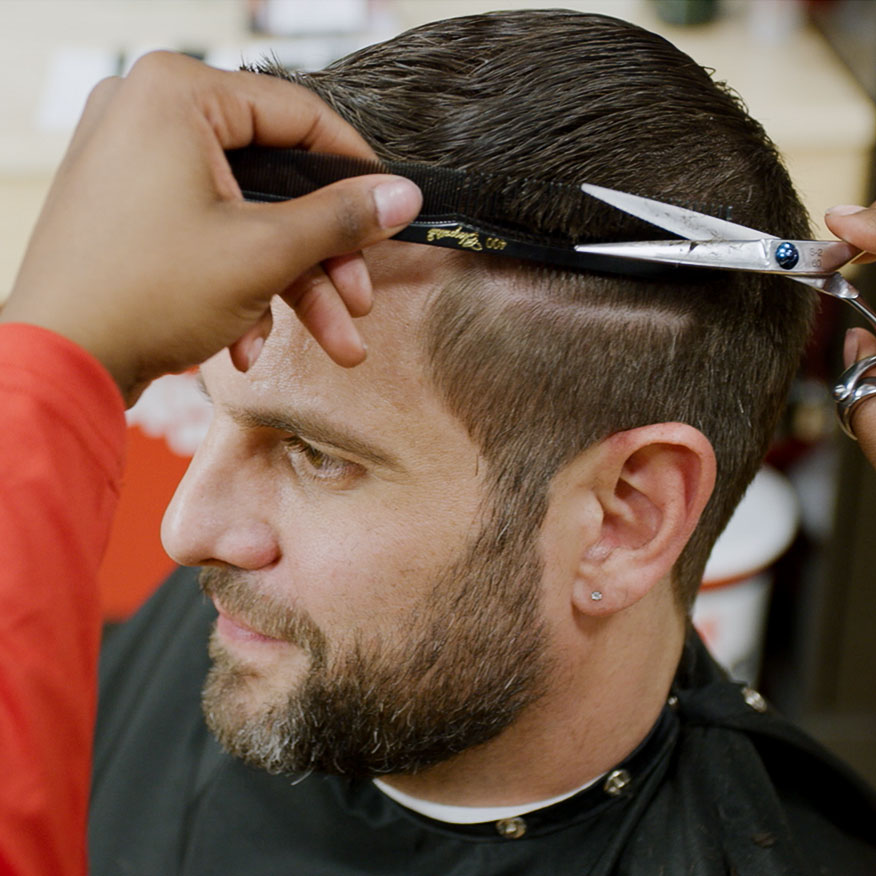 Stylist cutting Client hair